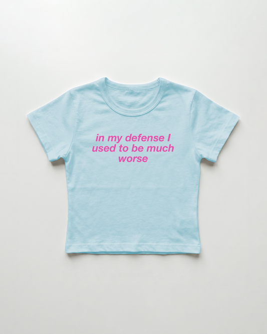 in my defense I used to be much worse cropped Baby Tee