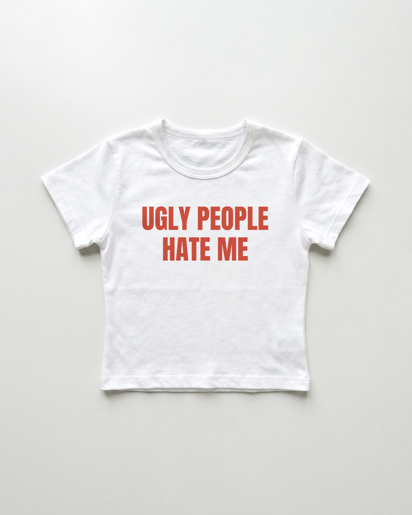 ugly people hate me cropped Baby Tee
