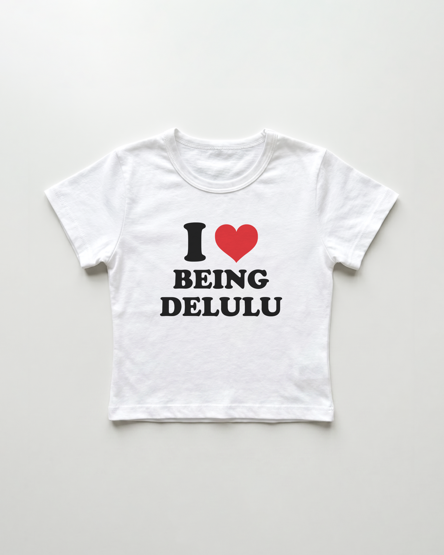 I love being delulu cropped Baby Tee Weiss | Lolita Sinz