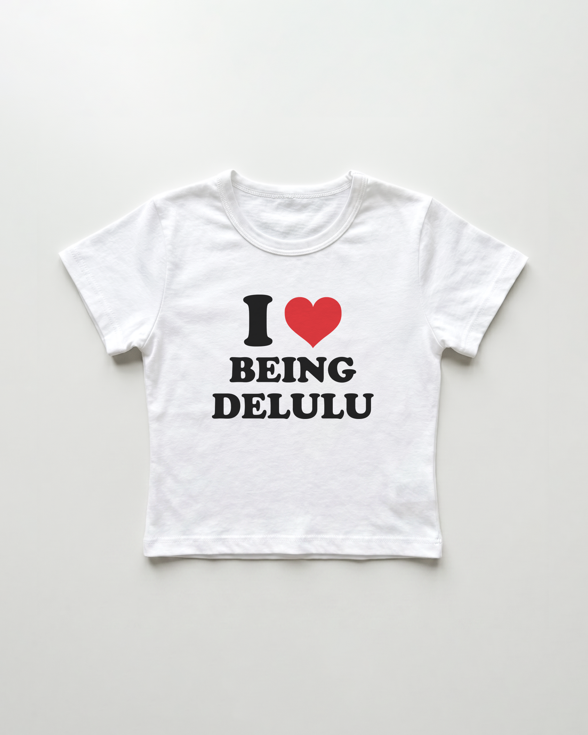 I love being delulu cropped Baby Tee Weiss | Lolita Sinz