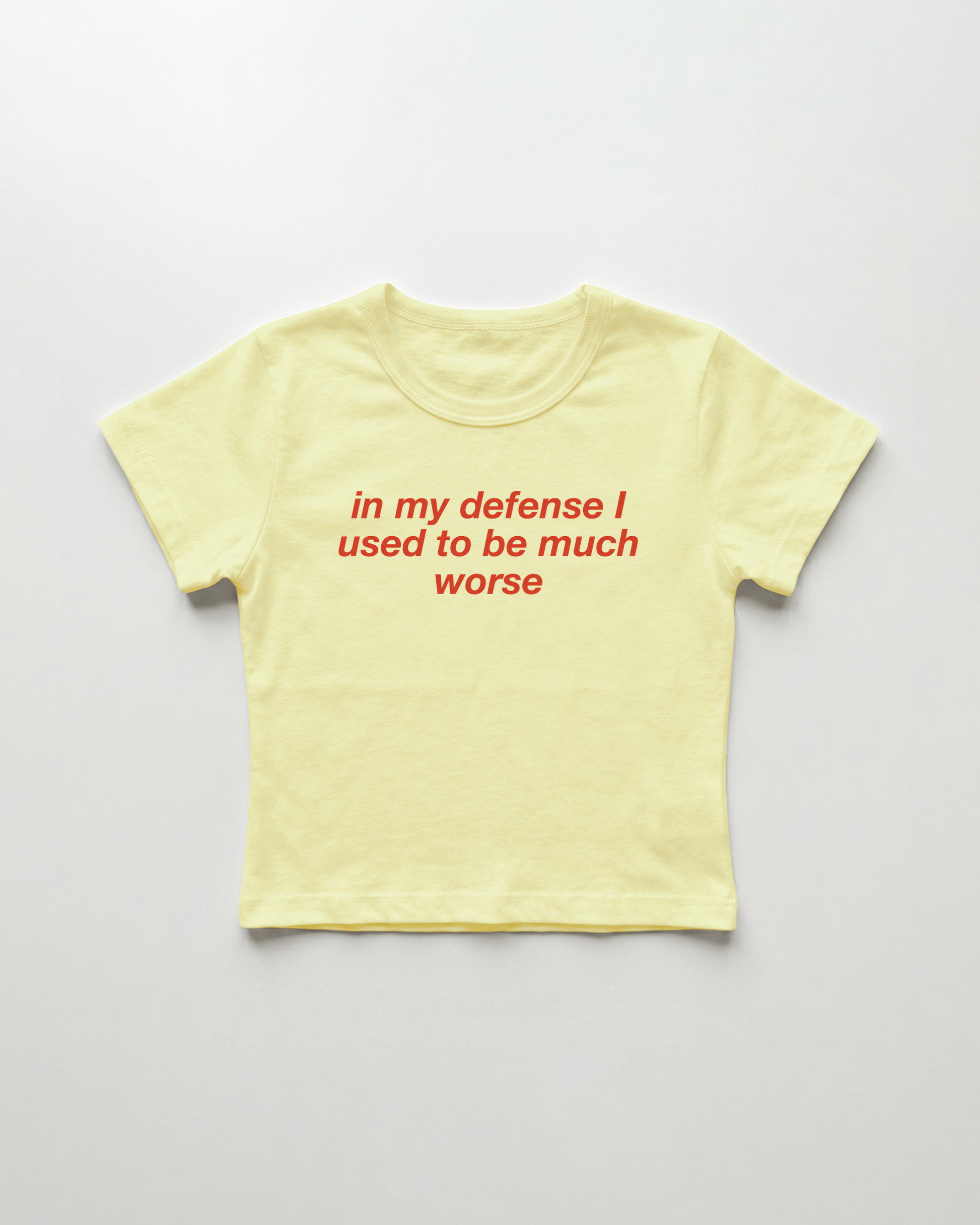 in my defense I used to be much worse cropped Baby Tee Gelb | Lolita Sinz