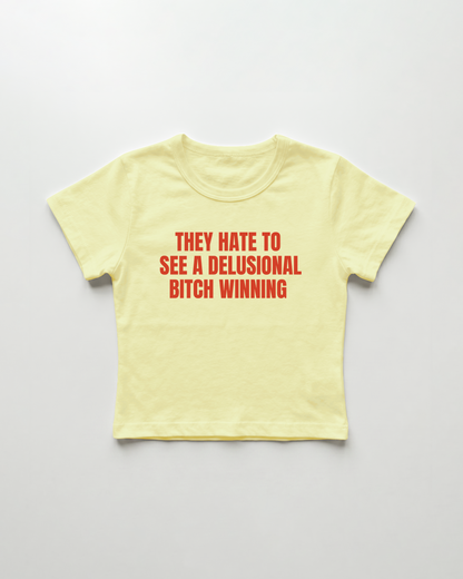 they hate to see a delusional bitch winning cropped Baby Tee
