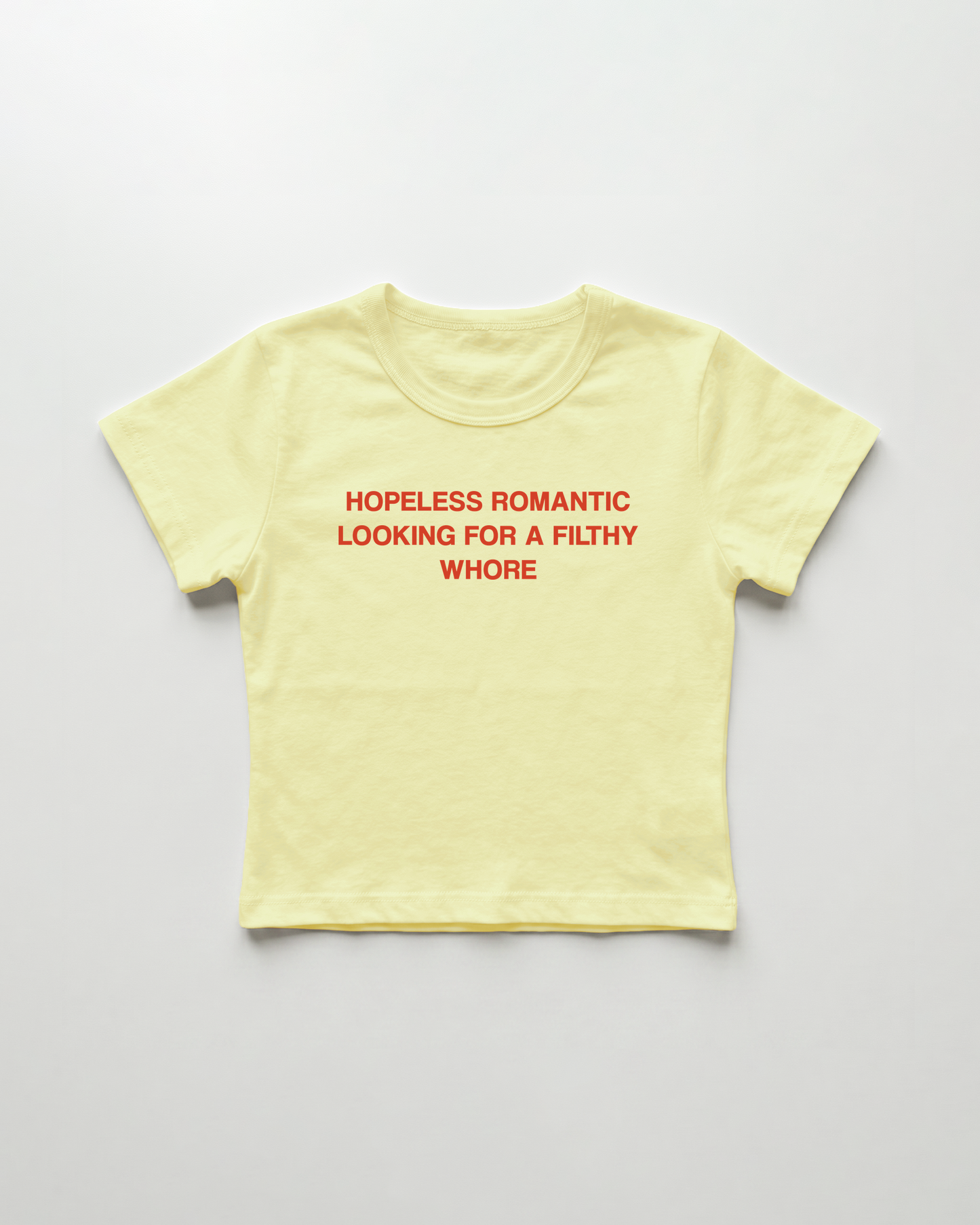 hopeless romantic looking for a filthy whore cropped Baby Tee Gelb | Lolita Sinz